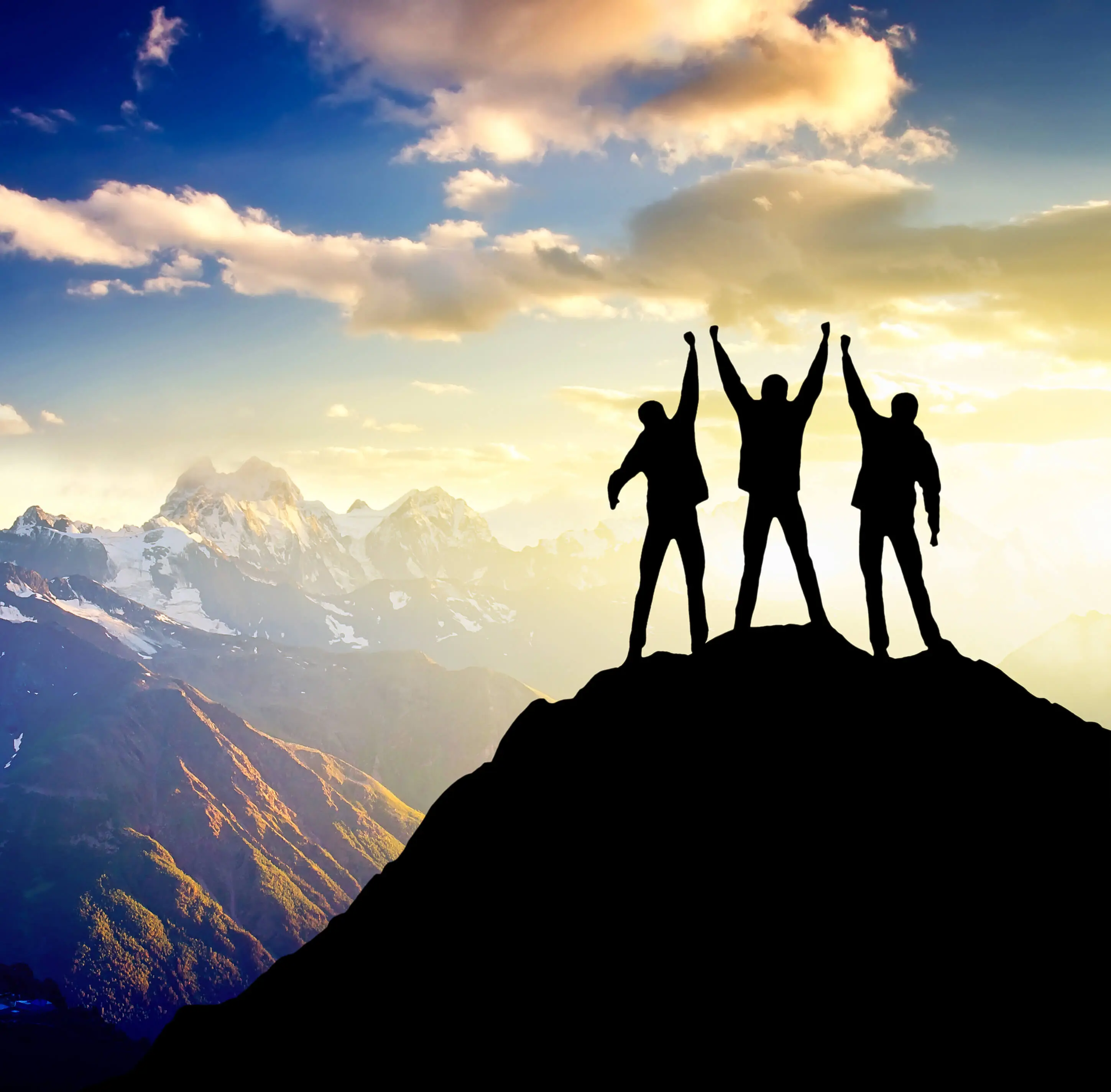 A group of people standing on a mountain